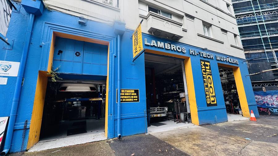 The Hi-Tech Mufflers shopfront on Bourke Street, Surry Hills, with both workshop bays open